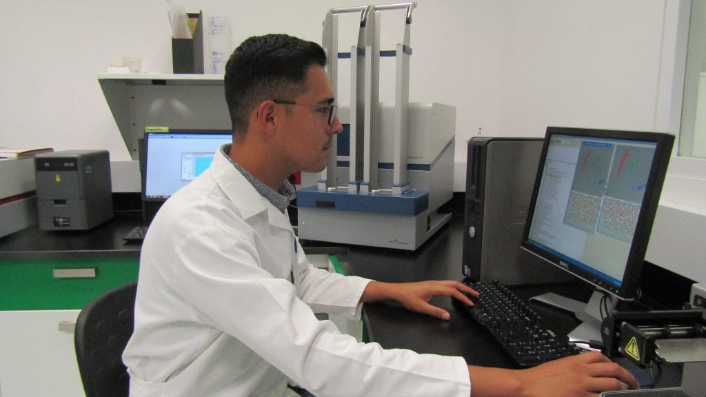 Guillermo Garcia Barrios, a co-author of the study and student at Colegio de Postgraduados in Montecillo, Mexico, with a PHERAstar machine used to validate genetic markers. (Photo: Marcia MacNeil/CIMMYT)