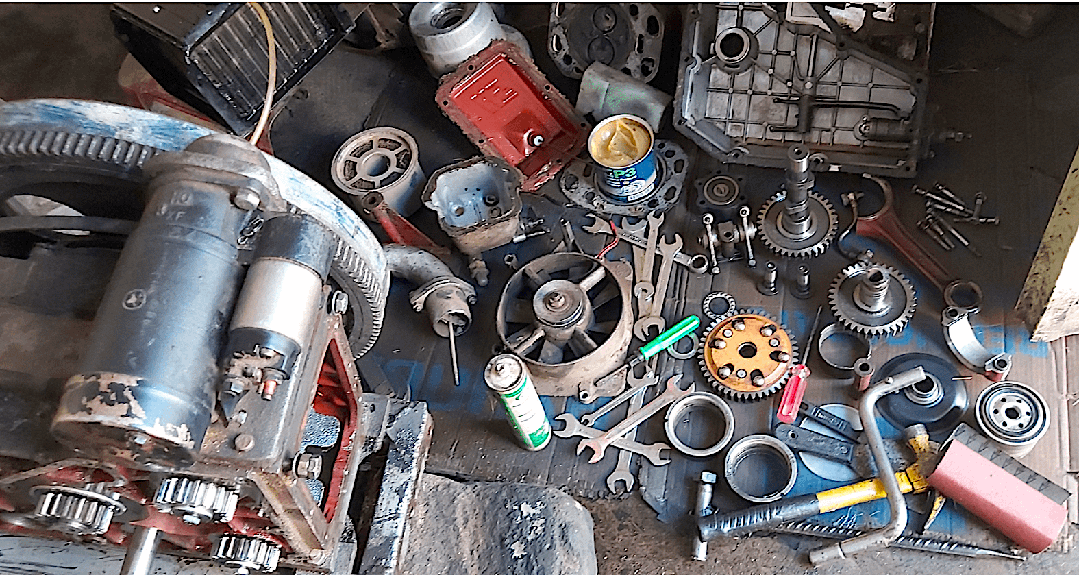 Tools and spare machinery parts lie on the ground during at Beyene Chufamo’s workshop in Meki, Ethiopia. (Photo: CIMMYT)