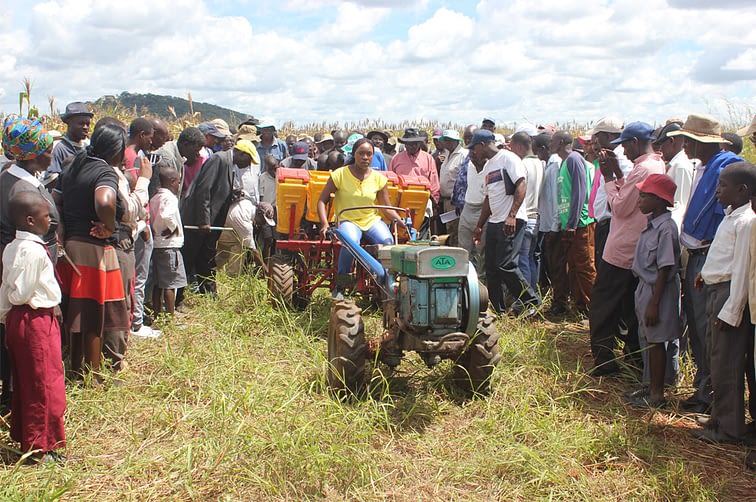 Farmers learn about two-wheel tractors. (Photo: CIMMYT)