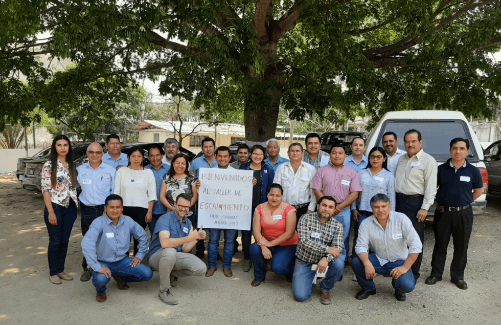Participants in the scaling workshop stand for a group photo with the trainers. (Photo: CIMMYT)